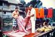 Thailand: Jim Thompson and a Cham weaver inspecting some silk, Ban Krua weaving community, Bangkok, c. 1962