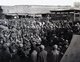 China: A crowd listening to a storyteller, Kashgar bazaar, Xinjiang, 1911.